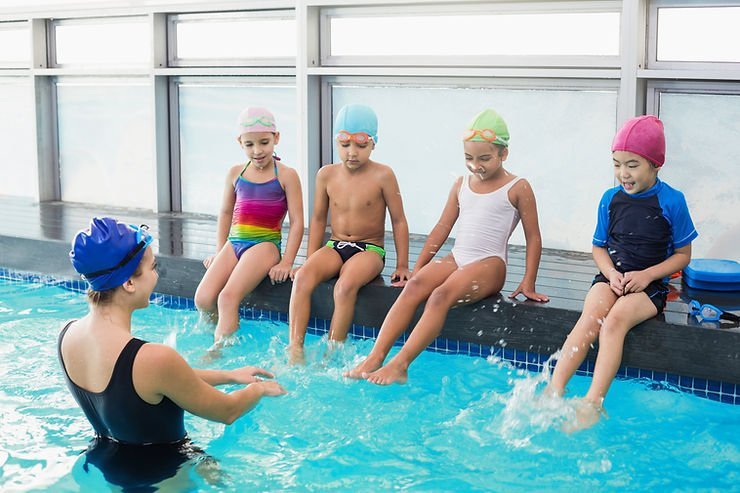 Kids learning how to swim for water safety.