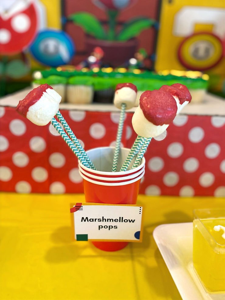 Candy coated marshmallow pops for Mario themed party 