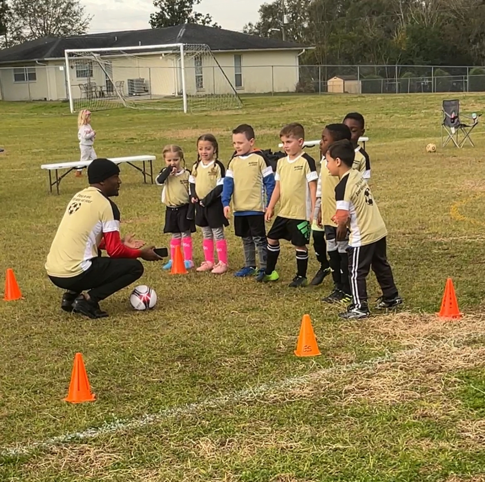 Playing soccer with a team 