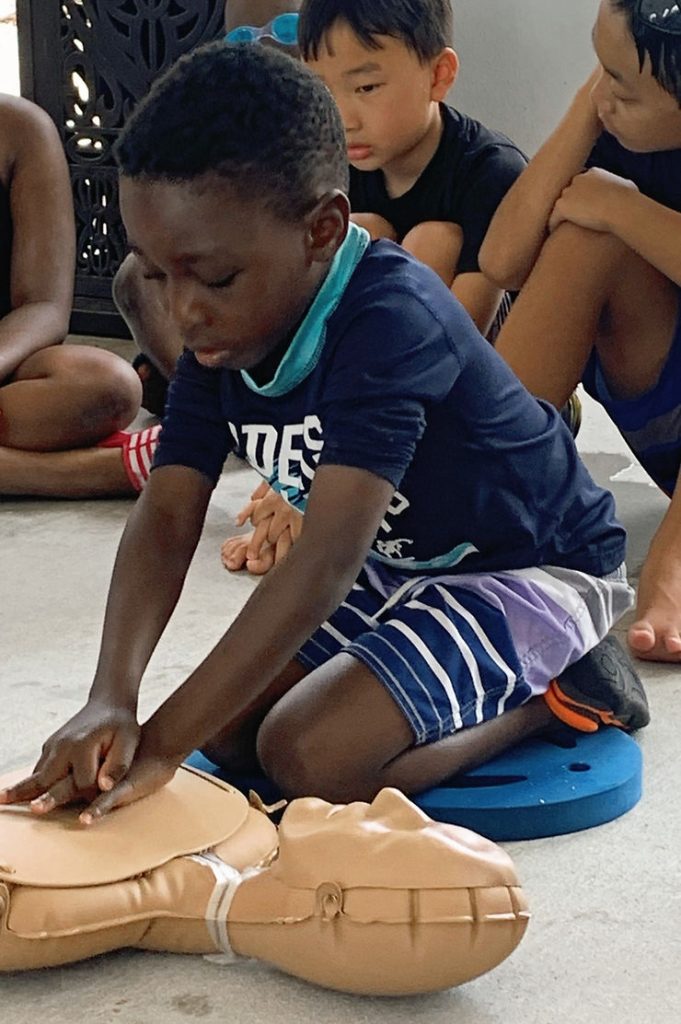 6-year-old doing CPR education.