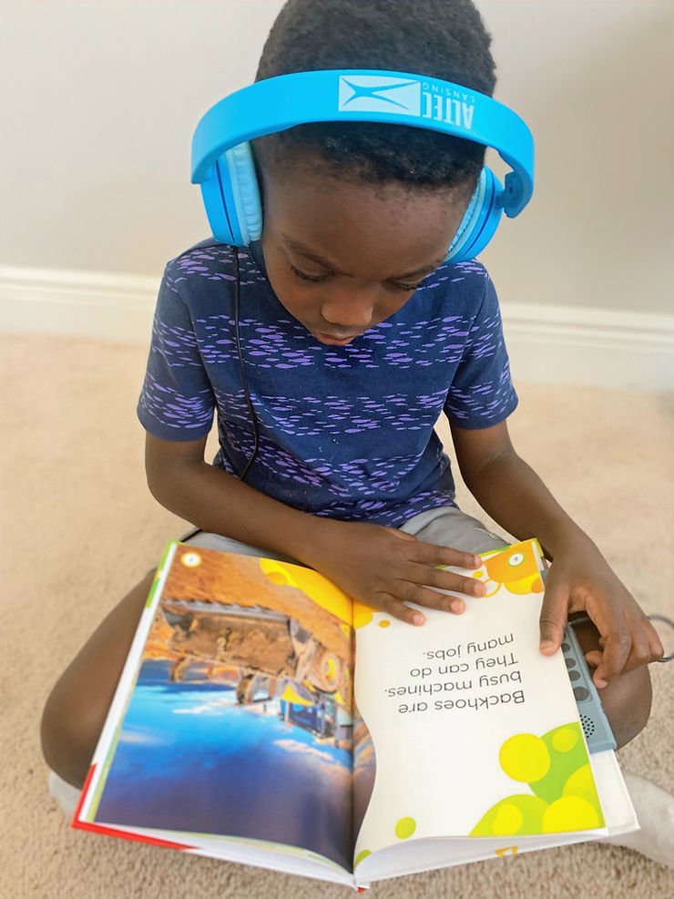 Listening to a Vox book being read.